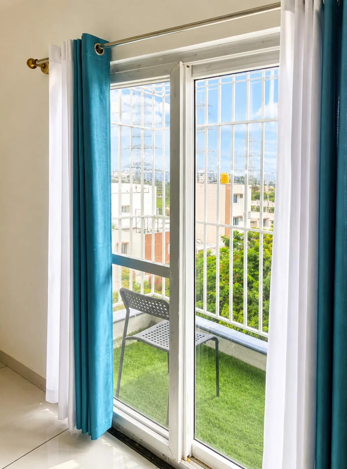 Bright balcony view through sliding door